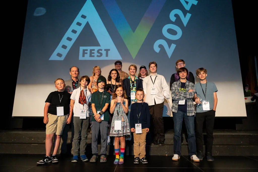 Young filmmaker students on stage at the 2024 annual film festival