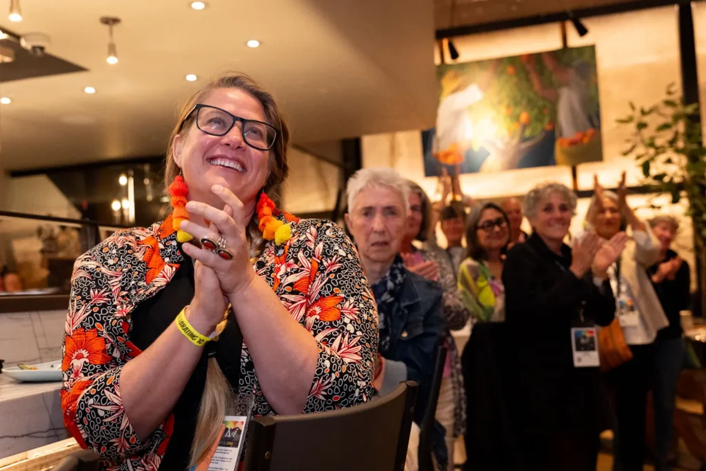 Closeup of woman clapping during event at annual film festival