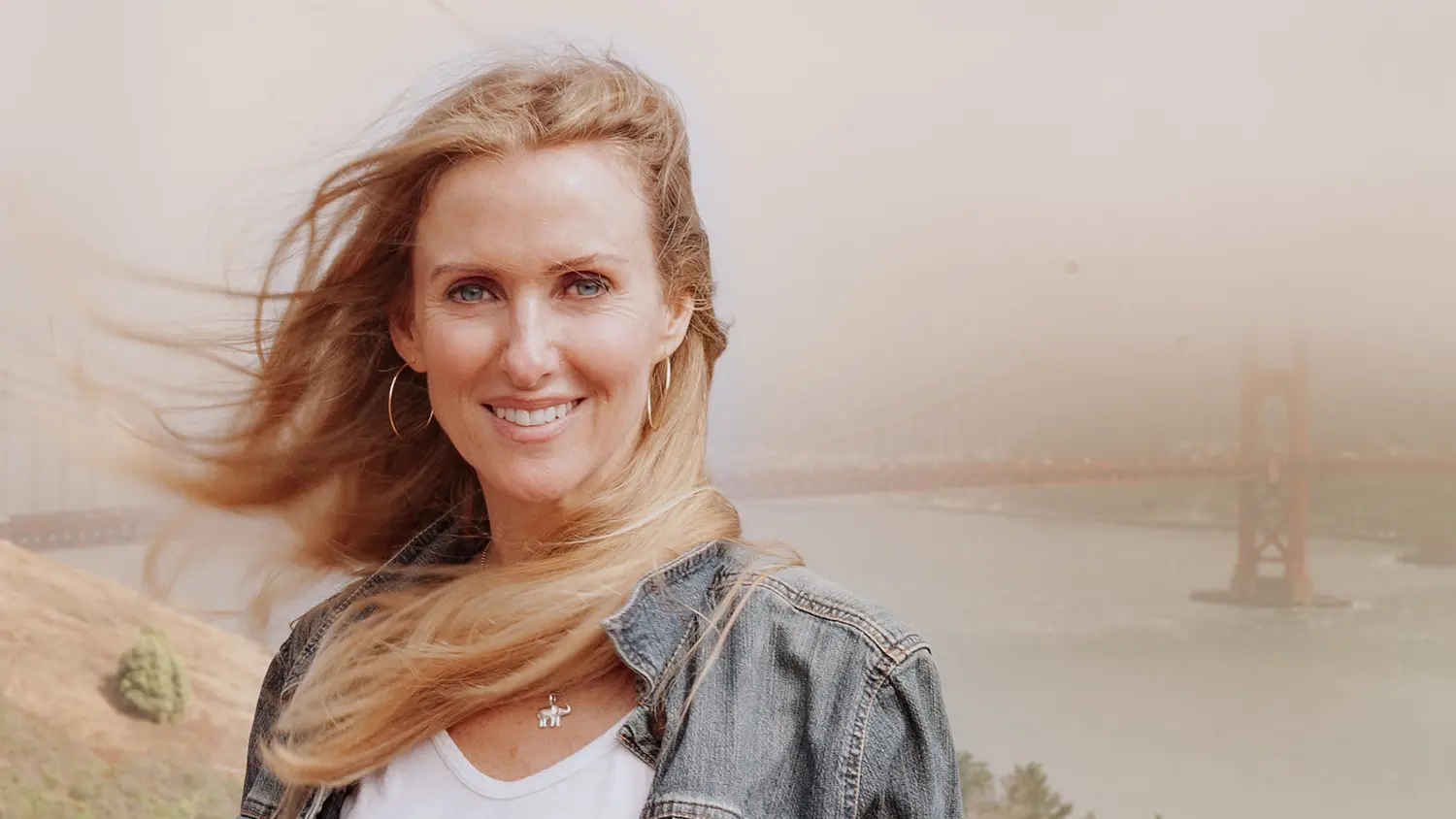 Jackie Hoffner poses for a picture with the Golden Gate Bridge behind her